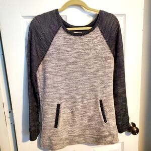 Long sleeved baseball style top with pockets. Size small